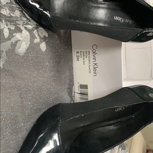 Black Calvin Klein pumps
